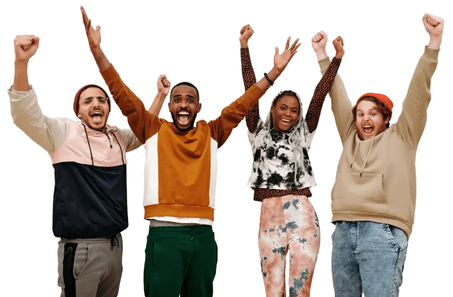 four young adults cheering with their hands the in the air
