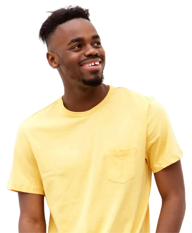 a smiling man in a yellow shirt
